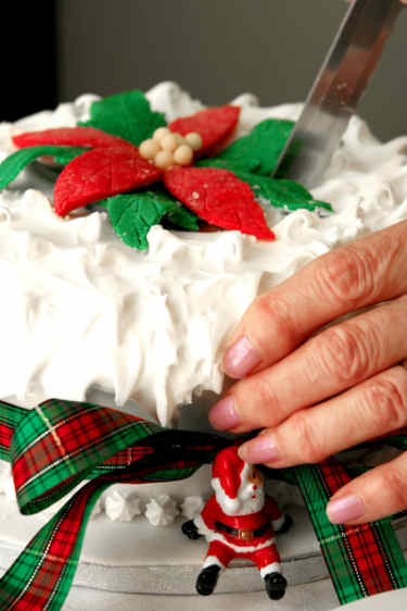 Christmas cake with royal icing and fondant poinsettia